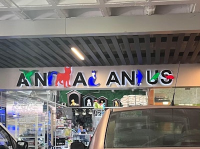 A shop sign that reads 'Animal Anus'