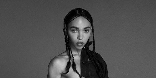 Detail from Calvin Klein’s advert featuring FKA Twigs, showing the singer wearing just a denim jacket, which is slung over her left shoulder with her right side exposed