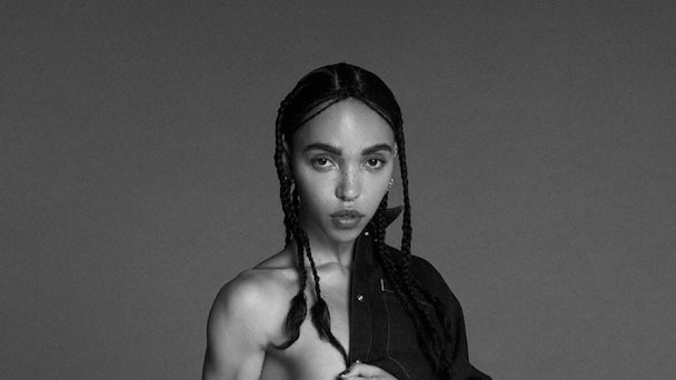 Detail from Calvin Klein’s advert featuring FKA Twigs, showing the singer wearing just a denim jacket, which is slung over her left shoulder with her right side exposed