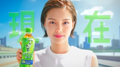 An AI-generated advertising image shows a virtual influencer holding up a bottle of a Korean soft drink