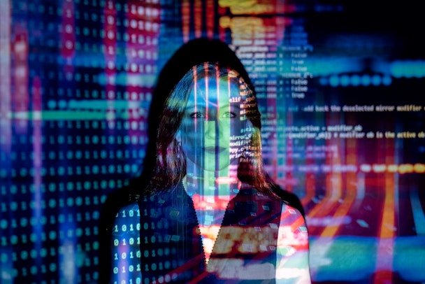A human person with a data screen being projected onto her