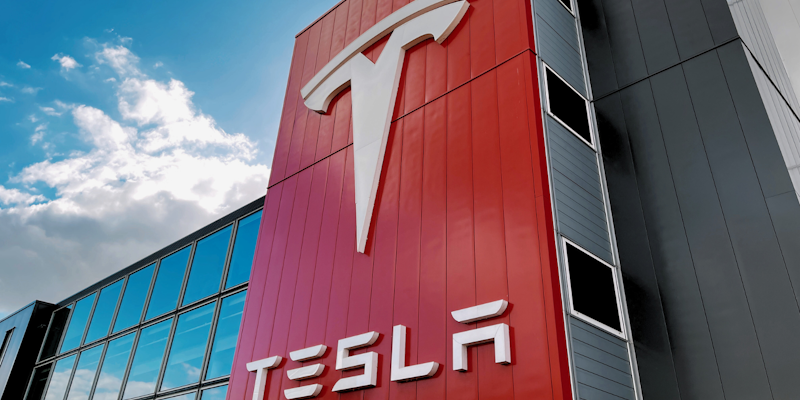 Tesla signage on the outside of a factory