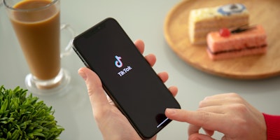 Phone displaying TikTok logo