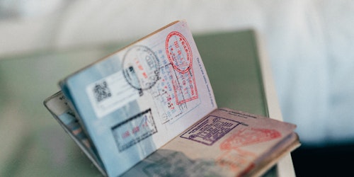 A passport with several customs stamps