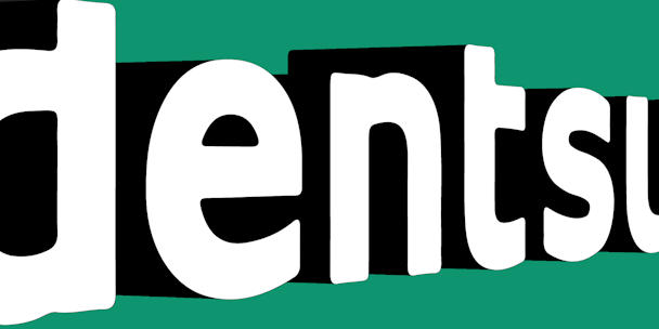 The Dentsu corporate wordmark, against a green background