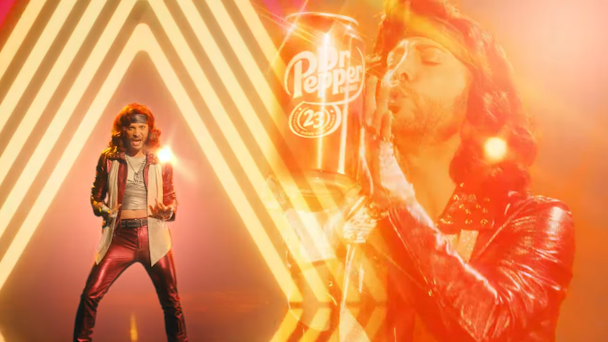 Dr Pepper mascot standing on a stage