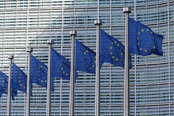 EU flags flutter in a line