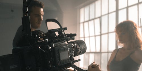 movie camera pointed at an actor movie camera pointed at an actor