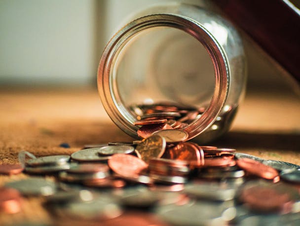 Money spilling over a table Money spilling over a table