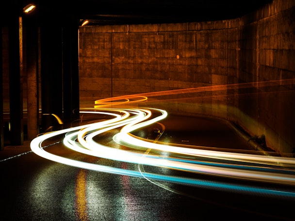 Low exposure photograph of cars in a tunnel