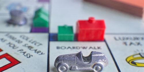 A car parked on a Monopoly board
