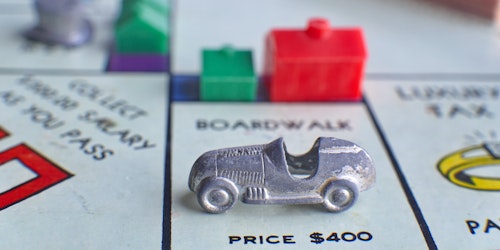 A car parked on a Monopoly board