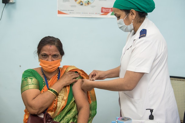 shutterstock image of vaccination efforts in India in 2021
