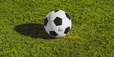 A football on a sports pitch
