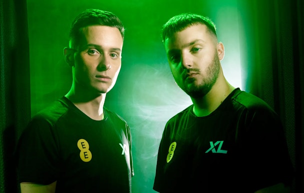 Two esports stars model the Excel kits complete with EE branding