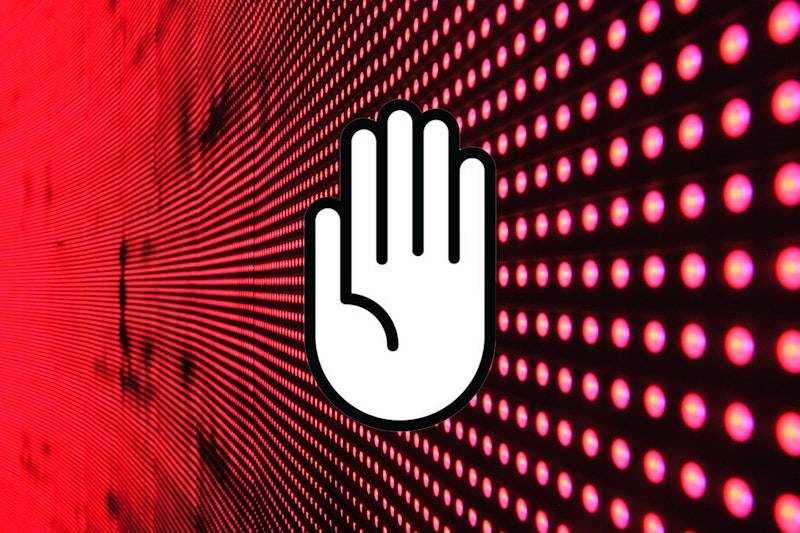 A white hand signifying stop over a digital stream of information