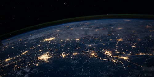 The world as seen from space, the nodes of cities interconnected through glowing circuit-like highways
