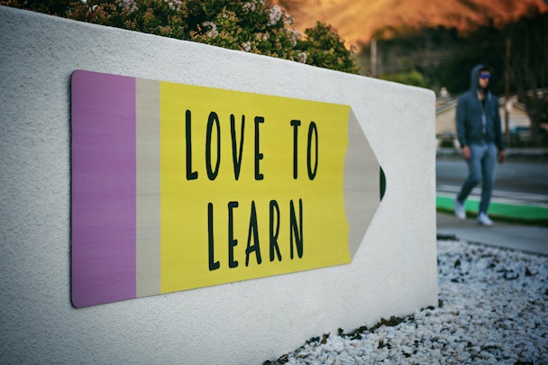 A sign reading 'Love To Learn' to illustrate the DMA's pilot scheme that encourages marketing companies to upskill workers in digital skills