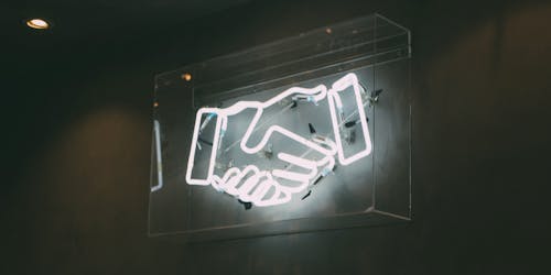 human hand neon signage on wall human hand neon signage on wall