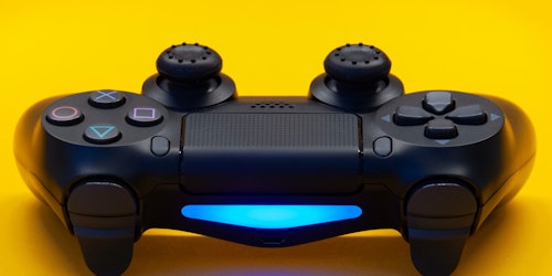 play station controller on yellow background