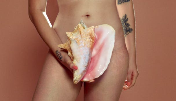 Woman holding a shell Woman holding a shell