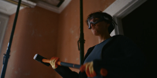 Woman holding a sledgehammer