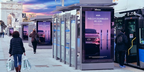JCDecaux Bus stop Billboard with Arc de Triumph in the background