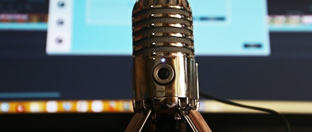 Microphone with computer screen in the background