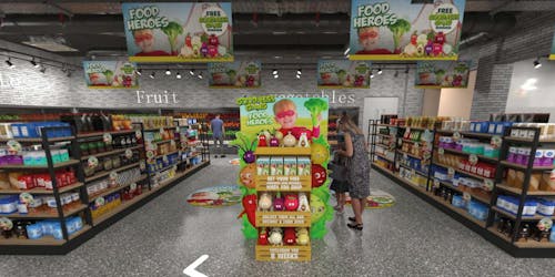 Woman in shopping Aisle with banners for food heroes Woman in shopping Aisle with banners for food heroes