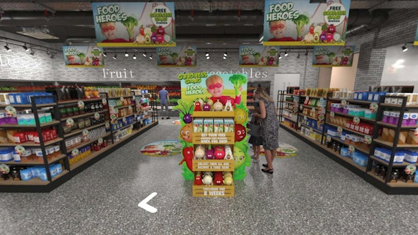 Woman in  shopping Aisle with banners for food heroes