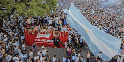 Argentina fans celebrate next to a shipping container full of Bud
