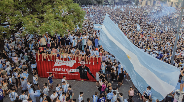 Argentina fans celebrate next to a shipping container full of Bud
