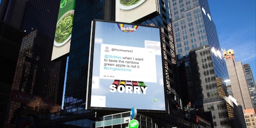 A Times Square billboard with a Skitttles ad apologizing to angry fans 