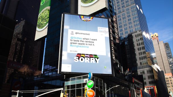 A Times Square billboard with a Skitttles ad apologizing to angry fans  A Times Square billboard with a Skitttles ad apologizing to angry fans