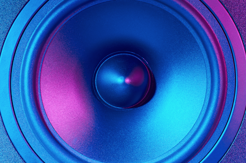 Sound audio speaker with neon lights. Dynamic monitor closeup