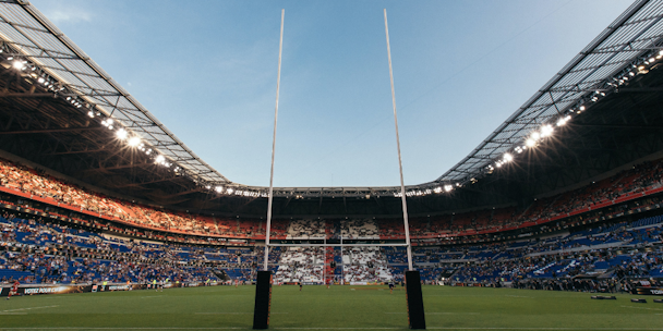 Photograph of a rugby stadium from behind the goal posts