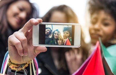Young women take a selfie.