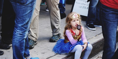 Little girl dressed as Wonder Woman.