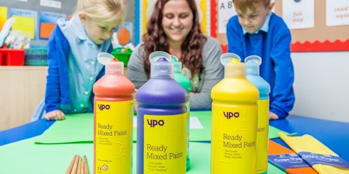 Bottles of YPO poster paint in a primary school class.