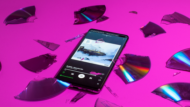 Phone atop shattered CD 