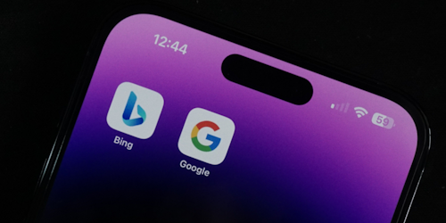 Bing and Google app logos next to each other on mobile phone screen