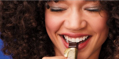 Woman eating chocolate Woman eating chocolate