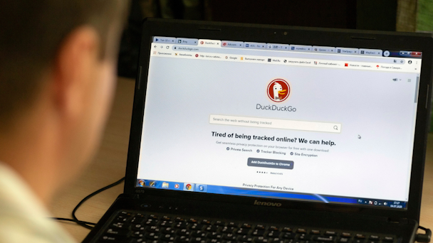 DuckDuckGo browser open on man's laptop