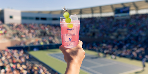 Hand holding Grey Goose honey deuce cocktail at US Open of tennis