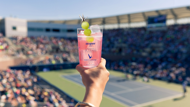 Hand holding Grey Goose honey deuce cocktail at US Open of tennis