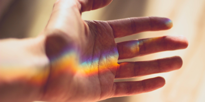 Rainbow refraction on palm of hand