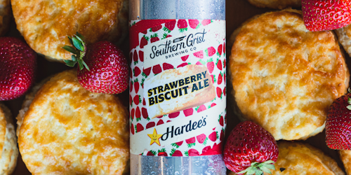 Southern Grist Brewing Co. Strawberry Biscuit Ale on pile of biscuits and strawberries