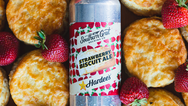 Southern Grist Brewing Co. Strawberry Biscuit Ale on pile of biscuits and strawberries