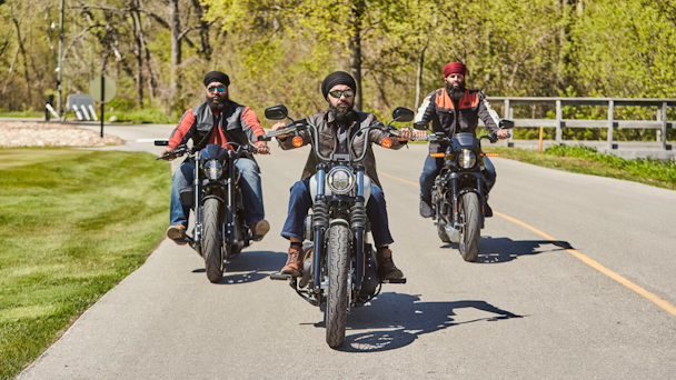 Three Sikh motorcyclists riding together