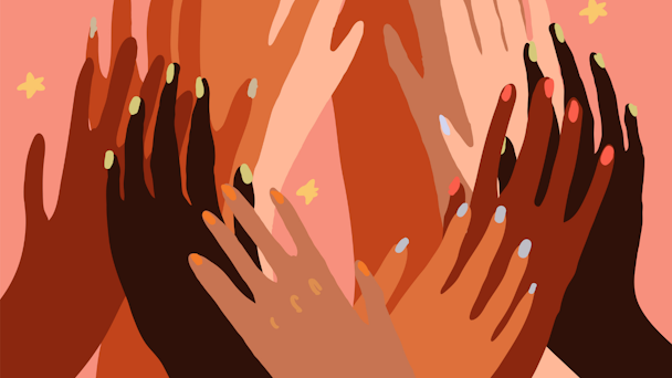 Hands of various skin tones overlapping on pink background